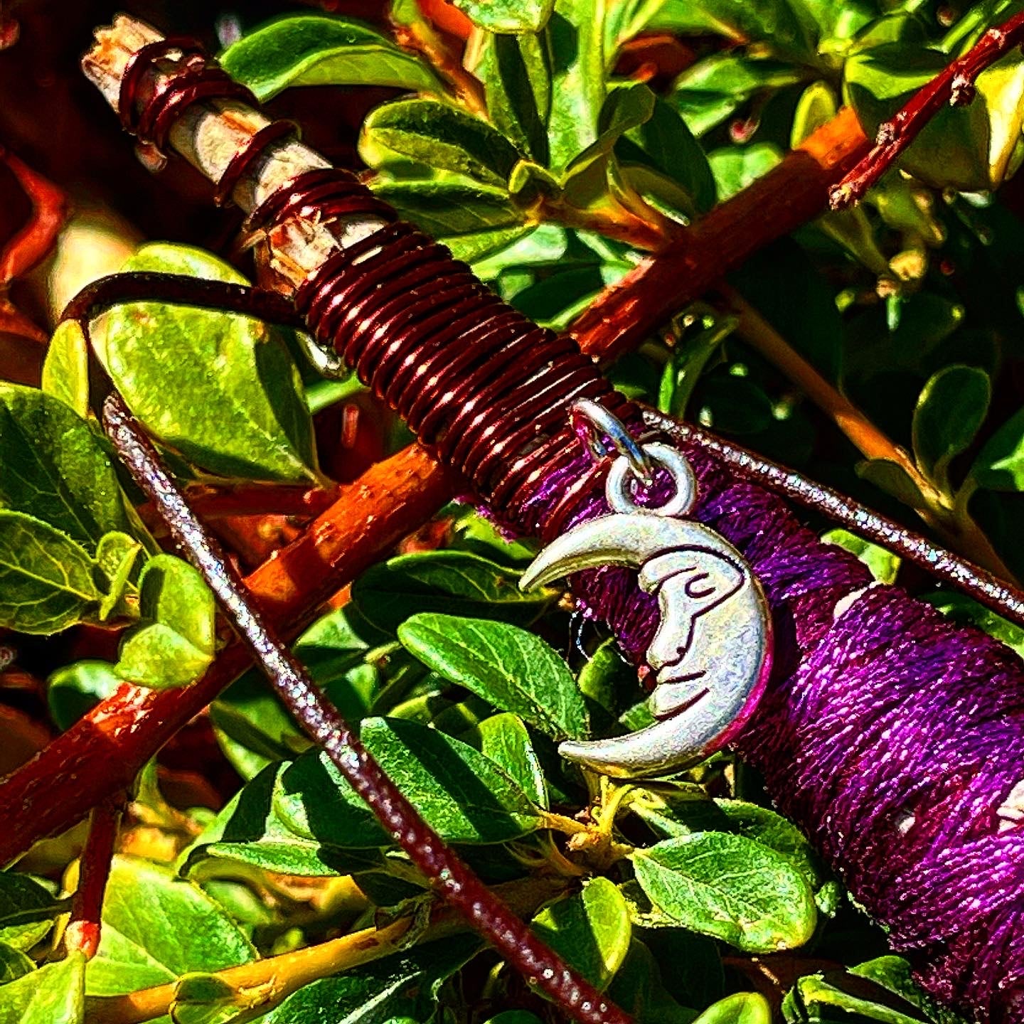 Wise Crescent sage necklace pendant, this is a photo of Sage jewelry made by Paul Adrian Moon, this specific piece has a Half Face Crescent Moon Pendant, Paul Adrian Moon is also a photographer in Southern California and graphic artist wrapping Sage necklaces for portable smudging and wear. Sage accessories, wire wrapping Sage and crystals. Burnable Sage. Handmade and natural